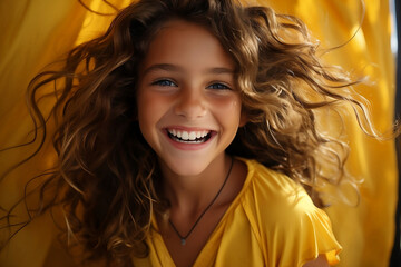 Portrait of a beauty happy girl in yellow dress. Happy smile of a girl. 