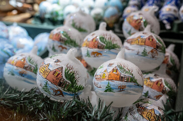 Salzburg, Austria, August 15 2022. A local handicraft product: decorated eggs to decorate on the occasion of the holidays. In the shop window they are displayed together with Christmas tree balls.