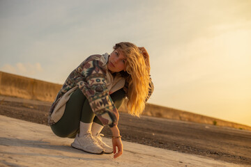 young sad poor woman seating alone at the street stressed and depressed