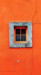Fototapeta na wymiar Orange wall with a grey-framed window