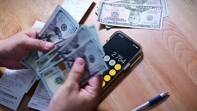Using their gadget, the person gestured with their thumb and fingers to input numbers into the font on the calculator to calculate bills