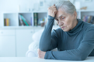 Close up portrait of a sick senior woman