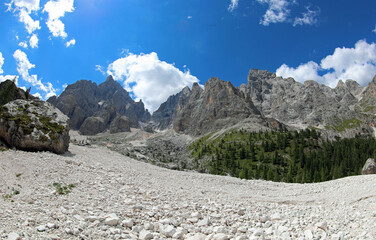 scree slope of mixed-sized rocks in the European Alps mountains of Italy in summer - obrazy, fototapety, plakaty