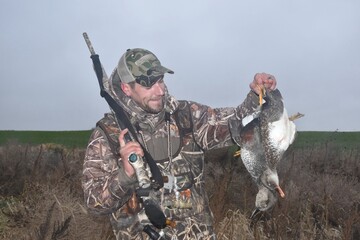Hunter with ducks 