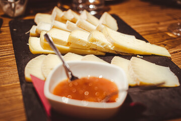 Cheese and jam plate for aperitif or appetizers.