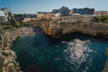 The beautiful Polignano a Mare, in the middle of the Puglia region, with its cliffs and clear water bays.