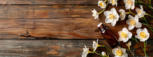 narcissus essential oil in a bottle. selective focus. - obrazy, fototapety, plakaty