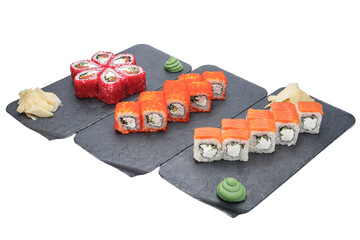 sushi on the black plate isolated on white background with clipping path © Kurganskiy