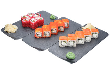 sushi on the black plate isolated on white background with clipping path © Kurganskiy
