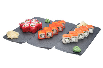 sushi on the black plate isolated on white background with clipping path © Kurganskiy