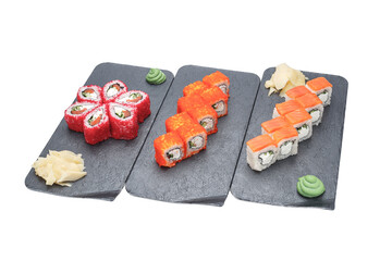 sushi on the black plate isolated on white background with clipping path © Kurganskiy