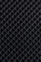 Close up of a black carbon fiber as a background. Macro.