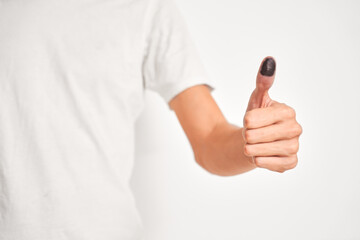 Male hand with ink thumb, after voting.
