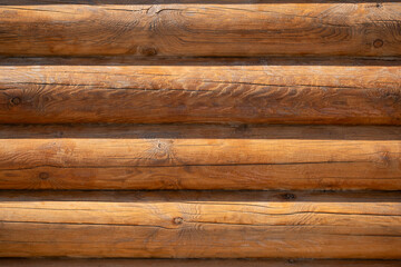 Wooden log house wall texture background, closeup view.