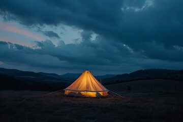 A tent illuminated at twilight - obrazy, fototapety, plakaty