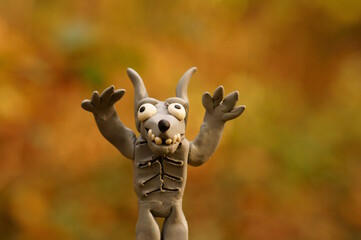 A toy werewolf made of plasticine. A child monster.