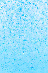Blue water drops background. Close up of water drops on glass.