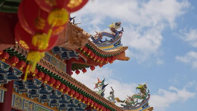 Ornate dragon sculpture on the edge of the Thean Hou Temple with Chinese new years lanters in Kaual Lumpur, Malaysia