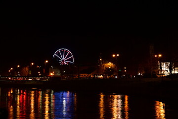 Ferris wheel at night on St. Patrick's Day. Kilkenny, Ireland
