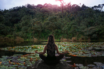 Woman meditation in nature forest