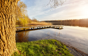 Scenic sunset with a pier on a lake near the town of Recz, West Pomeranian Voivodeship, Poland. - 782317777