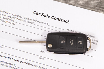 Car sale contract and car key. Sales, purchases of vehicle