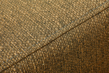 Textured brown furniture fabric with stitching