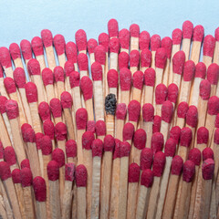 Matches representing individual in a crowd creative people concept.