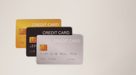 Three credit cards on white background..