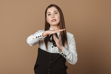 Dissatisfied Young Woman Using Hand Gestures to Timeout, as if Saying 'Enough is Enough. Ideal for Discontent, Boundaries, and Communication Challenges