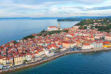 Aerial view of Piran old town, Slovenia, beautiful landmark. Scenic cityscape with medieval architecture and red tiled roofs, famous tourist resort on Adriatic seacoast, outdoor travel background - 782346326