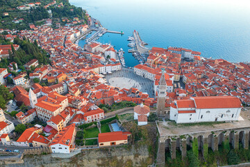 Aerial view of Piran old town, Slovenia, beautiful landmark. Scenic cityscape with medieval architecture and red tiled roofs, famous tourist resort on Adriatic seacoast, outdoor travel background - 782346338