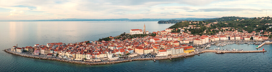 Aerial view of Piran old town, Slovenia, beautiful landmark. Scenic cityscape with medieval architecture and red tiled roofs, famous tourist resort on Adriatic seacoast, outdoor travel background - 782346392