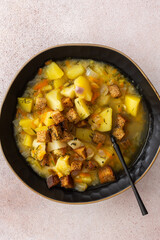 Pea soup with fried croutons, healthy bean soup, top view