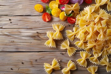 Farfalle pasta with vegetable slices on wooden background Horizontal top view
