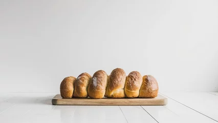 Papier Peint photo Lavable Pain freshly baked bread against a white background