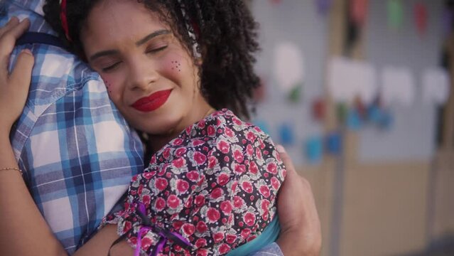 Brazilian June Festival, romantic woman slow dancing at celebration in Brazil in costume