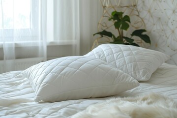 Orthopedic pillows for better sleep on a white bed