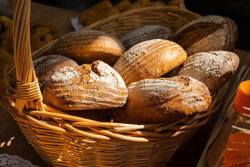 Basket of fresh bread. Freshly baked bread in different shapes. High quality photo