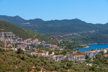Beautiful view of the seaside resort town of Kas in Turkey. Villas and hotels with red roofs are open to tourists