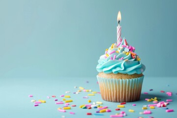 Text space available for delicious birthday cupcake featuring a candle placed on a light blue background
