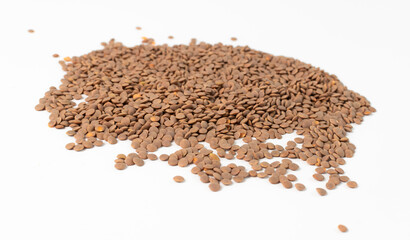 Lentils are piled on a white table
