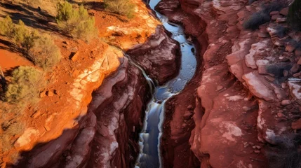 Zelfklevend Fotobehang a river flowing through a canyon © Xanthius
