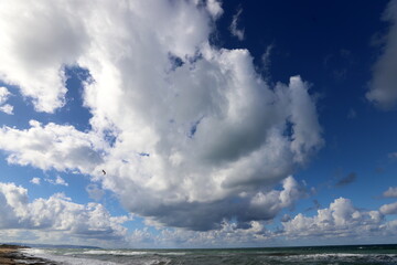 Naklejka na ściany i meble Rain clouds in the sky over the Mediterranean Sea.