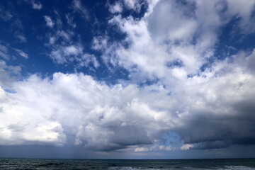 Rain clouds in the sky over the Mediterranean Sea.