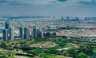 Aerial view of Dubai with skyscrapers and golf course, United Arab Emirates