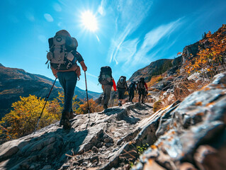 A group of hikers hiking the mountain trail, low angle photo 