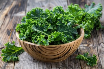 Kale leaves in wooden bowl on wooden background