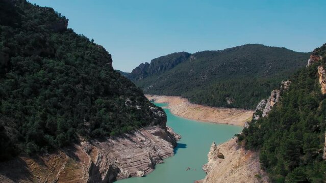 aerial shot of epic river canyon and groups of kayaks passing through breathtaking  4K  