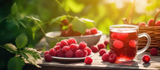 Glass of raspberry tea with fresh berries